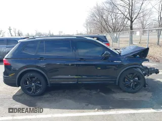 2023 Volkswagen Tiguan SE R-Line Black with VIN 3VVCB7AXXPM094621, listed as a IAAI auction lot 41737103 with 21,069 mi miles and . Bid and sale history available at DreamBid. Image 13.