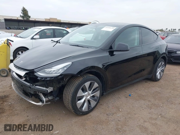 2023 Tesla Model Y Long Range with VIN 7SAYGDEEXPA044335, listed as a IAAI auction lot 42350159 with 26,731 mi miles and . Bid and sale history available at DreamBid. Image 2.