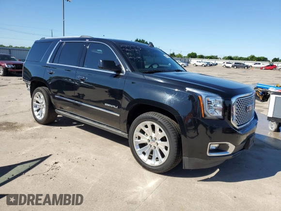 2015 GMC Yukon Denali z VIN 1GKS1CKJ8FR748131, wystawiony jako Copart lot #55213205 z przebiegiem 101 758 mil mil oraz Szkoda całkowita • Salvage title. Historia ofert i sprzedaży dostępna na DreamBid. Obrazek 4.