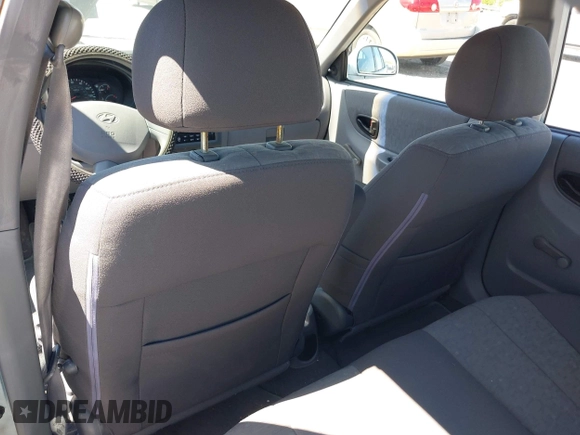 2005 Hyundai Accent GLS with VIN KMHCG45C75U658672, listed as a IAAI auction lot 42107140 with 34,351 mi miles. Bid and sale history available at carsss.com. Image 14.