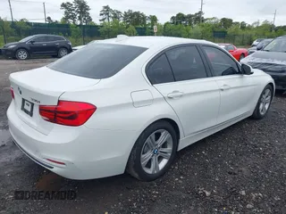 2018 BMW 3 Series 330i xDrive with VIN WBA8D9C52JEM32318, listed as a IAAI auction lot 42309352 with 61,828 mi miles and . Bid and sale history available at DreamBid. Image 4.