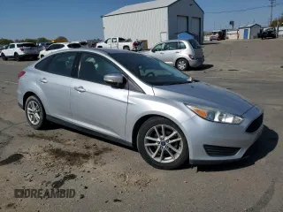 2015 Ford Focus SE with VIN 1FADP3F28FL241020, listed as a Copart auction lot 54559135 with 123,008 mi miles and Salvage title. Bid and sale history available at DreamBid. Image 4.