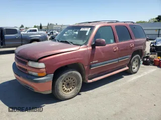 2001 Chevrolet Tahoe LT with VIN 1GNEC13T71R164164, listed as a Copart auction lot 60066165 with 234,506 mi miles and Salvage title. Bid and sale history available at DreamBid. Image 1.