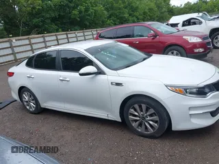 2018 Kia Optima S with VIN 5XXGT4L36JG265878, listed as a IAAI auction lot 42302801 with 101,927 mi miles and . Bid and sale history available at DreamBid. Image 14.