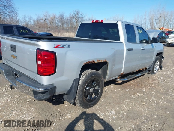 2014 Chevrolet Silverado 1500 LT with VIN 1GCVKREC0EZ151088, listed as a IAAI auction lot 41763808 with 124,668 mi miles and . Bid and sale history available at DreamBid. Image 4.