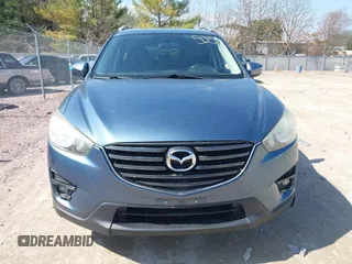 2016 Mazda CX-5 Grand Touring z VIN JM3KE4DY6G0785255, wystawiony jako IAAI lot #41887066 z przebiegiem 171 334 mil mil oraz . Historia ofert i sprzedaży dostępna na DreamBid. Obrazek 13.