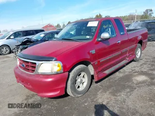 2000 Ford F-150 XL with VIN 2FTRX17W2YCA79002, listed as a IAAI auction lot 41605570 with 322,154 mi miles. Bid and sale history available at carsss.com. Image 2.