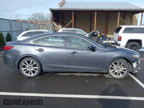 2014 Mazda 6 i Grand Touring with VIN JM1GJ1W63E1147380, listed as a IAAI auction lot 41928637 with 140,091 mi miles and . Bid and sale history available at DreamBid. Image 14.