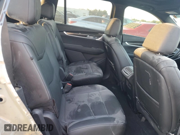 2023 Cadillac XT6 AWD Sport z VIN 1GYKPGRS6PZ108561, wystawiony jako Copart lot #71052284 z przebiegiem 31 496 mil mil oraz Szkoda całkowita • Salvage title. Historia ofert i sprzedaży dostępna na DreamBid. Obrazek 11.