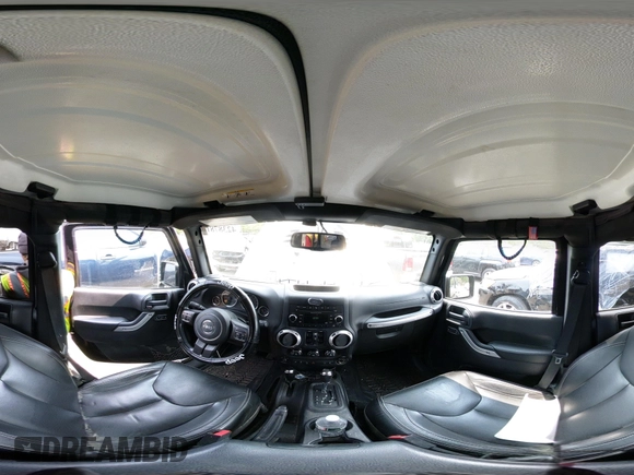 2015 Jeep Wrangler Unlimited Sahara with VIN 1C4HJWEG3FL661568, listed as a IAAI auction lot 42387810 with 140,927 mi miles and . Bid and sale history available at DreamBid. Image 19.
