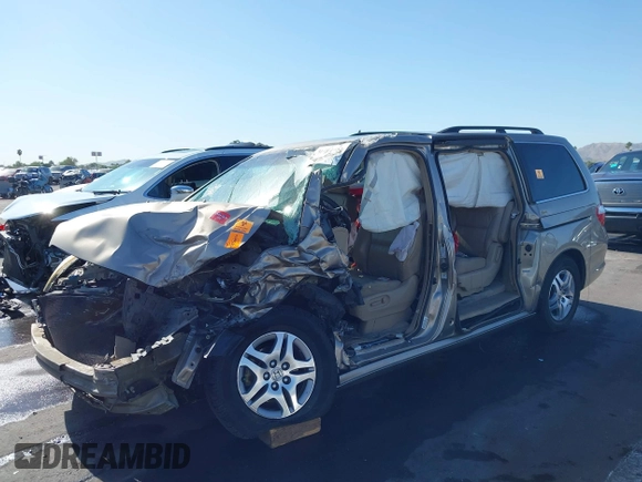 2005 Honda Odyssey EX-L with VIN 5FNRL38755B063203, listed as a IAAI auction lot 41073372 with Not provided miles and . Bid and sale history available at DreamBid. Image 2.
