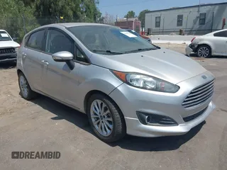 2014 Ford Fiesta SE z VIN 3FADP4EJ1EM196126, wystawiony jako IAAI lot #42360125 z przebiegiem 121 057 mil mil oraz . Historia ofert i sprzedaży dostępna na DreamBid. Obrazek 1.