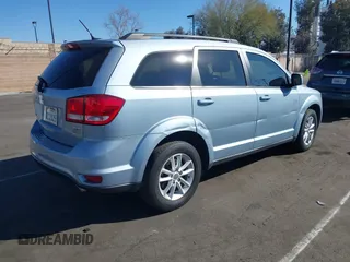 2013 Dodge Journey SXT with VIN 3C4PDCBG5DT674863, listed as a IAAI auction lot 41670225 with 207,524 mi miles. Bid and sale history available at carsss.com. Image 4.