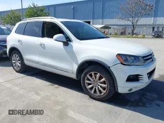 2012 Volkswagen Touareg Sport with VIN WVGEF9BP5CD007294, listed as a IAAI auction lot 41841268 with 160,883 mi miles and . Bid and sale history available at DreamBid. Image 1.