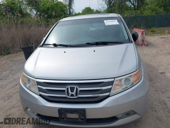 2012 Honda Odyssey Touring with VIN 5FNRL5H92CB055473, listed as a IAAI auction lot 42128601 with 163,901 mi miles. Bid and sale history available at carsss.com. Image 12.