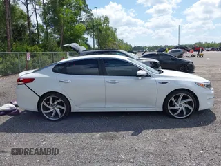 2018 Kia Optima LX z VIN 5XXGT4L39JG272694, wystawiony jako IAAI lot #42155363 z przebiegiem 115 417 mil mil oraz . Historia ofert i sprzedaży dostępna na DreamBid. Obrazek 13.