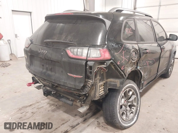 2020 Jeep Cherokee Trailhawk z VIN 1C4PJMBX4LD507364, wystawiony jako IAAI lot #41202333 z przebiegiem 90 000 mil mil oraz . Historia ofert i sprzedaży dostępna na DreamBid. Obrazek 6.