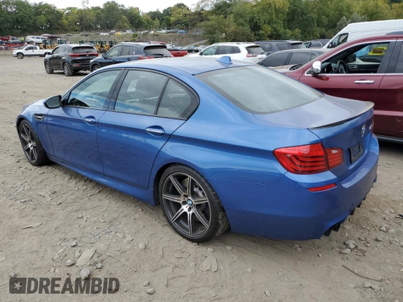 2014 BMW M5 z VIN WBSFV9C5XED097563, wystawiony jako Copart lot #72175354 z przebiegiem 73 406 mil mil oraz Szkody całkowita. Historia ofert i sprzedaży dostępna na DreamBid. Obrazek 2.