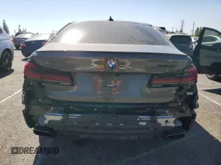 2022 BMW 5 Series M550i xDrive z VIN WBA13BK0XNCJ23778, wystawiony jako Copart lot #76946634 z przebiegiem 24 889 mil mil oraz Szkoda całkowita • Salvage title. Historia ofert i sprzedaży dostępna na DreamBid. Obrazek 6.