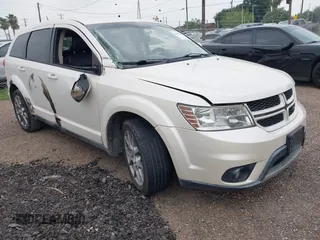 2013 Dodge Journey R/T with VIN 3C4PDCEG5DT642751, listed as a IAAI auction lot 42306951 with 129,338 mi miles and . Bid and sale history available at DreamBid. Image 1.