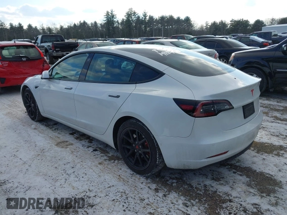 2020 Tesla Model 3 Standard Range Plus with VIN 5YJ3E1EA7LF742973, listed as a IAAI auction lot 41409285 with 48,993 mi miles and . Bid and sale history available at DreamBid. Image 3.