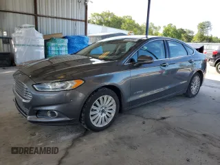 2015 Ford Fusion SE Hybrid z VIN 3FA6P0LU5FR218454, wystawiony jako Copart lot #60682065 z przebiegiem 218 668 mil mil oraz Szkoda całkowita • Salvage title. Historia ofert i sprzedaży dostępna na DreamBid. Obrazek 1.