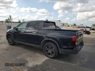 2019 Honda Ridgeline Sport with VIN 5FPYK2F15KB003142, listed as a Copart auction lot 57058235 with 173,049 mi miles and Clean title. Bid and sale history available at DreamBid. Image 2.
