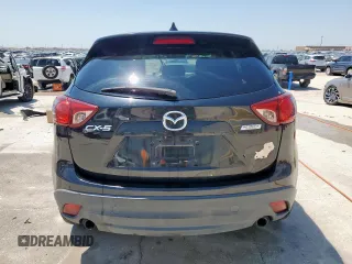 2014 Mazda CX-5 Touring with VIN JM3KE2CY5E0316077, listed as a Copart auction lot 58218735 with 190,789 mi miles and Salvage title. Bid and sale history available at DreamBid. Image 6.