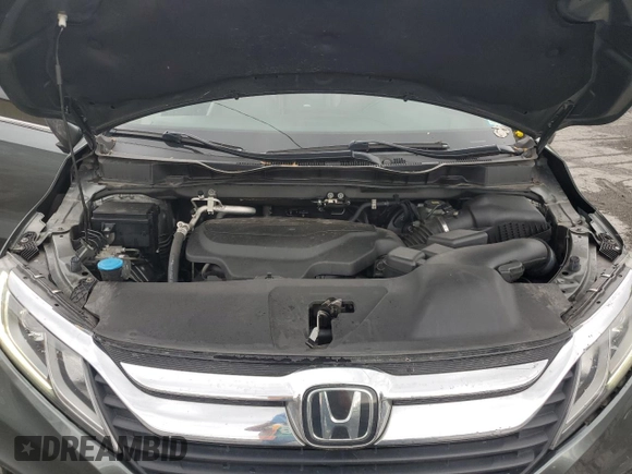 2018 Honda Odyssey EX-L z VIN 5FNRL6H75JB076769, wystawiony jako Copart lot #56845755 z przebiegiem 92 552 mil mil oraz Szkoda całkowita • Salvage title. Historia ofert i sprzedaży dostępna na DreamBid. Obrazek 12.