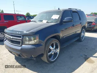 2007 Chevrolet Tahoe LTZ with VIN 1GNFC13017R285839, listed as a IAAI auction lot 42002091 with 210,039 mi miles and . Bid and sale history available at DreamBid. Image 2.