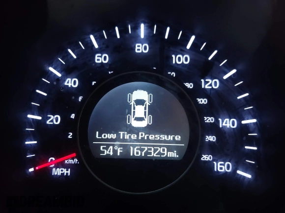 2015 Kia Optima LX with VIN 5XXGM4A74FG483165, listed as a IAAI auction lot 41117924 with 167,329 mi miles. Bid and sale history available at carsss.com. Image 7.