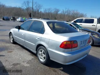 1999 Honda Civic VP with VIN 2HGEJ6615XH528453, listed as a IAAI auction lot 41655363 with 163,816 mi miles. Bid and sale history available at carsss.com. Image 3.