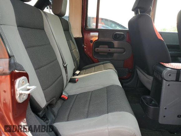 2007 Jeep Wrangler Unlimited X z VIN 1J4GA391X7L169728, wystawiony jako Copart lot #59484265 z przebiegiem 165 674 mil mil oraz Szkoda całkowita • Salvage title. Historia ofert i sprzedaży dostępna na DreamBid. Obrazek 10.