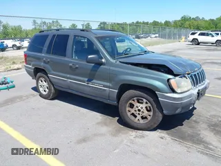 2002 Jeep Grand Cherokee with VIN 1J4GX38S12C244933, listed as a IAAI auction lot 42037931 with 171,201 mi miles and . Bid and sale history available at DreamBid. Image 1.