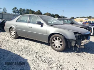 2008 Cadillac DTS 1SD z VIN 1G6KD57Y68U140938, wystawiony jako Copart lot #77525974 z przebiegiem 148 132 mil mil oraz Szkoda całkowita • Salvage title. Historia ofert i sprzedaży dostępna na DreamBid. Obrazek 4.