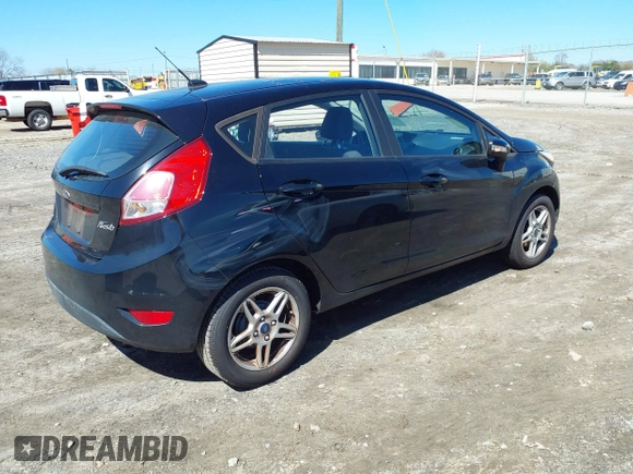 2017 Ford Fiesta SE with VIN 3FADP4EJ5HM164039, listed as a IAAI auction lot 41769636 with 56,778 mi miles. Bid and sale history available at carsss.com. Image 4.