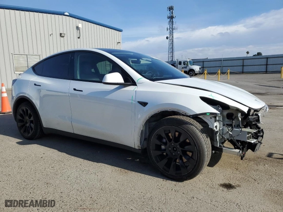 2022 Tesla Model Y Long Range with VIN 7SAYGDEE1NF559238, listed as a Copart auction lot 86744664 with 59,074 mi miles and Salvage Title. Bid and sale history available at carsss.com. Image 4.