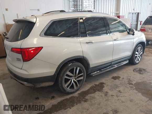 2017 Honda Pilot Touring with VIN 5FNYF6H92HB032873, listed as a IAAI auction lot 41608870 with 123,888 mi miles. Bid and sale history available at carsss.com. Image 4.