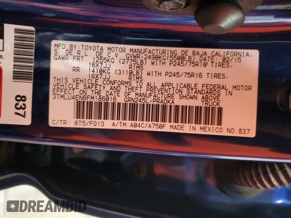 2015 Toyota Tacoma with VIN 3TMLU4EN6FM186016, listed as a Copart auction lot 58404675 with 127,536 mi miles and Salvage title. Bid and sale history available at DreamBid. Image 13.
