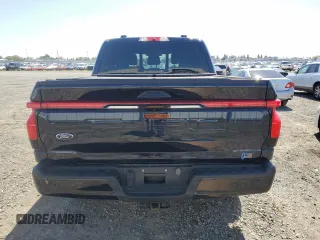 2023 Ford F-150 Lightning Pro with VIN 1FT6W1EV0PWG28960, listed as a Copart auction lot 51858855 with Not Provided miles and Non Repairable. Bid and sale history available at DreamBid. Image 6.