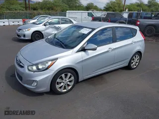 2012 Hyundai Accent SE with VIN KMHCU5AE7CU030632, listed as a IAAI auction lot 41290434 with 98,182 mi miles. Bid and sale history available at carsss.com. Image 2.