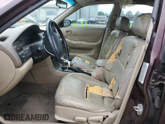 1998 Mazda 626 DX z VIN 1YVGF22CXW5775511, wystawiony jako Copart lot #78748784 z przebiegiem 158 570 mil mil oraz Szkoda całkowita • Salvage title. Historia ofert i sprzedaży dostępna na DreamBid. Obrazek 7.