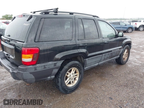2004 Jeep Grand Cherokee Laredo with VIN 1J4GW48S74C390569, listed as a IAAI auction lot 42384503 with 191,530 mi miles and . Bid and sale history available at DreamBid. Image 4.