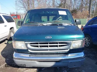 1999 Ford Econoline Cargo with VIN 1FDRE14W3XHB36482, listed as a IAAI auction lot 41393346 with 130,669 mi miles. Bid and sale history available at carsss.com. Image 12.