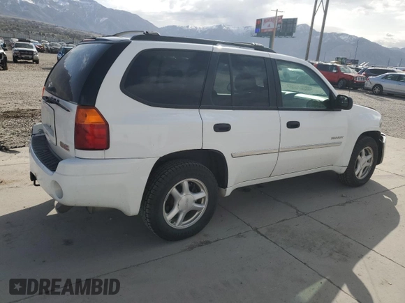 2006 GMC Envoy SLE z VIN 1GKDT13S462156541, wystawiony jako Copart lot #52500615 z przebiegiem 140 558 mil mil oraz Szkody całkowita. Historia ofert i sprzedaży dostępna na DreamBid. Obrazek 3.
