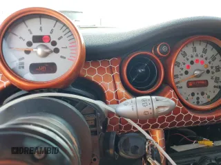 2004 MINI Hardtop with VIN WMWRC33444TC50103, listed as a Copart auction lot 63449615 with 144,467 mi miles and Salvage title. Bid and sale history available at DreamBid. Image 9.