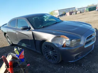 2013 Dodge Charger SXT with VIN 2C3CDXHG3DH593614, listed as a IAAI auction lot 42138282 with 174,243 mi miles. Bid and sale history available at carsss.com. Image 1.
