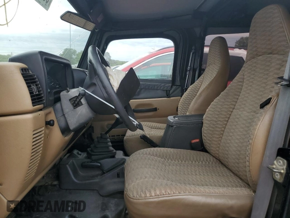 1999 Jeep Wrangler SE with VIN 1J4FY29P3XP408468, listed as a Copart auction lot 55537335 with Not provided miles and Salvage title. Bid and sale history available at DreamBid. Image 7.