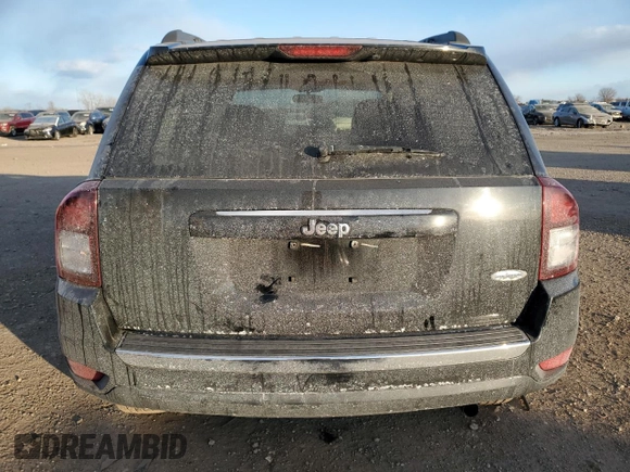 2014 Jeep Compass High Altitude with VIN 1C4NJCEAXED680799, listed as a Copart auction lot 89081285 with 63,447 mi miles and Salvage Title. Bid and sale history available at carsss.com. Image 6.