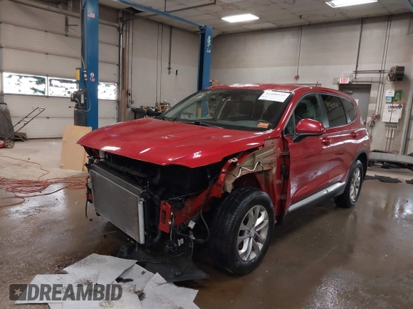2019 Hyundai Santa Fe SE z VIN 5NMS2CAD3KH125454, wystawiony jako IAAI lot #42400534 z przebiegiem 75 155 mil mil oraz . Historia ofert i sprzedaży dostępna na DreamBid. Obrazek 2.